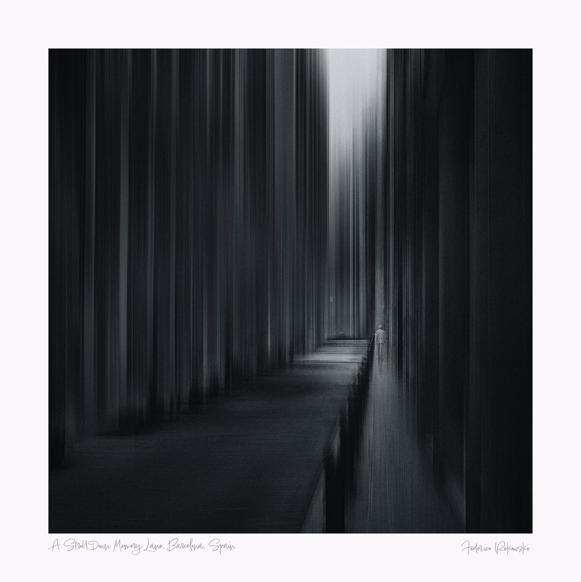 "Black and white artistic photograph showing a blurred figure walking along a path lined with vertical streaks in Barcelona."