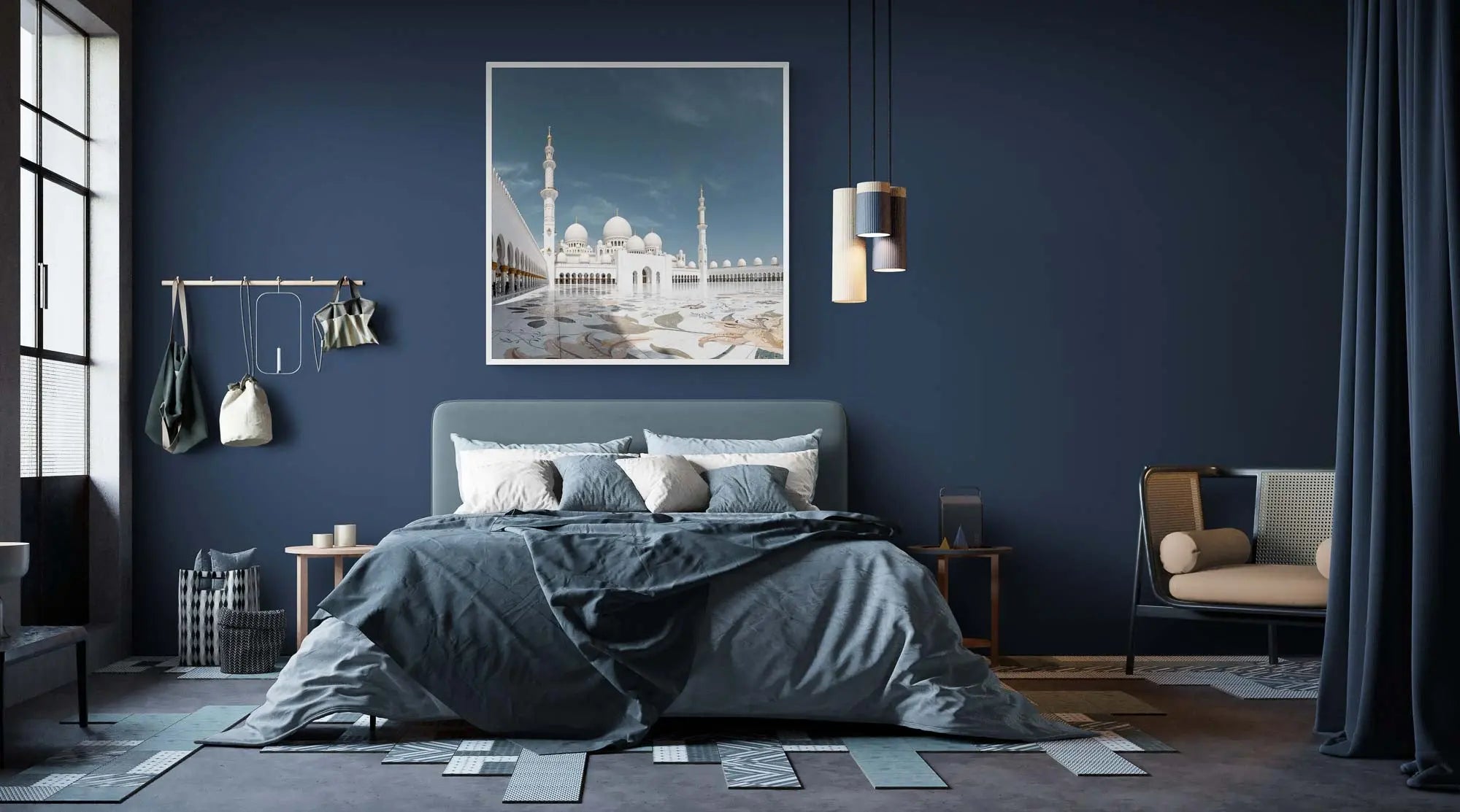 The Sheikh Zayed Grand Mosque in Abu Dhabi with its white marble domes and minarets, reflected on the glossy courtyard surface under a clear blue sky.