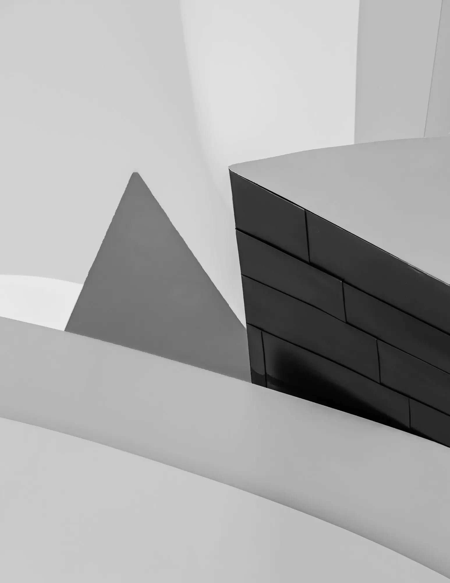 Abstract geometric shapes in a monochrome palette at the Guggenheim Museum Bilbao, showcasing contemporary architectural design.