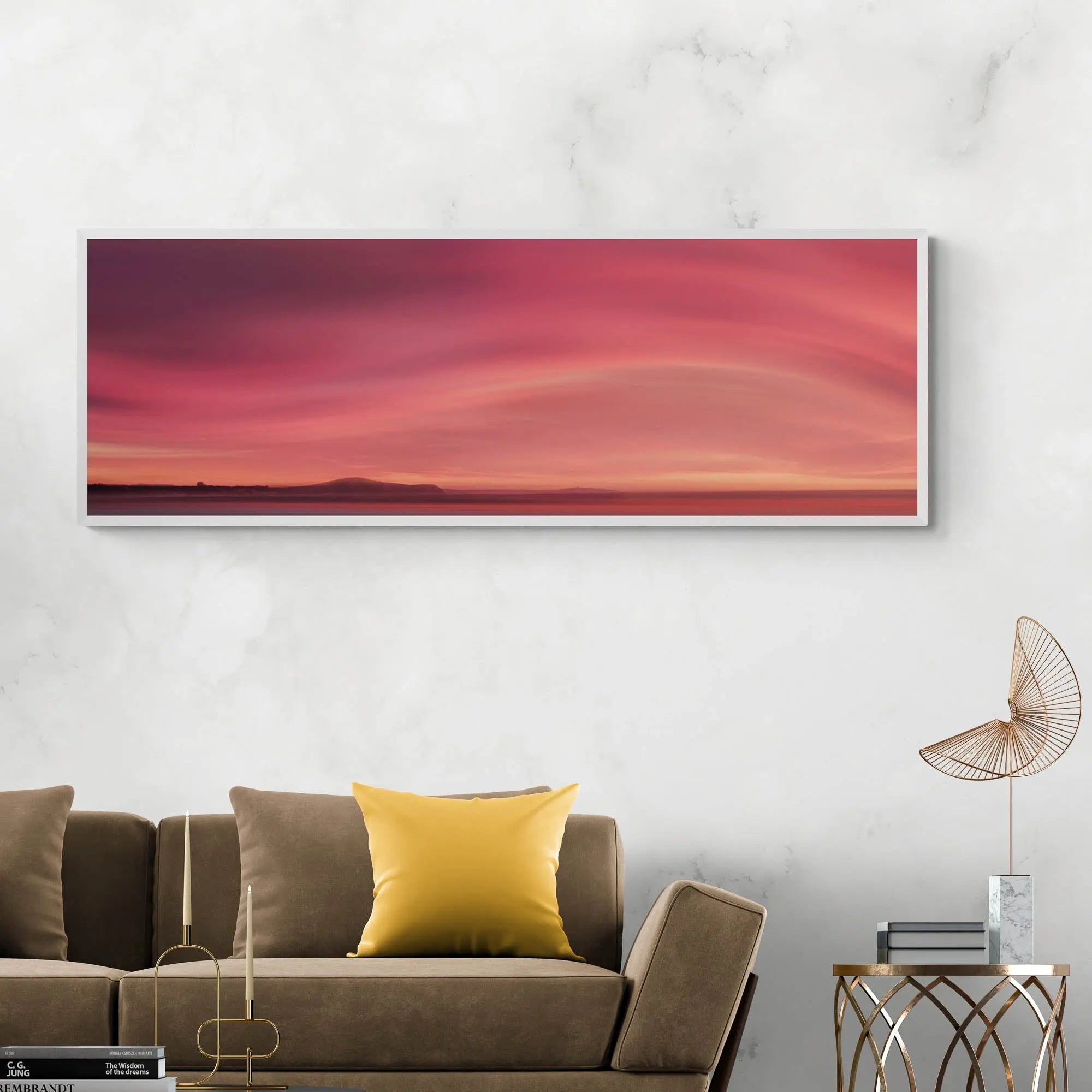 Sunrise over Moeraki Beach depicted in a photograph, showcasing vibrant red and pink clouds stretched across the sky.