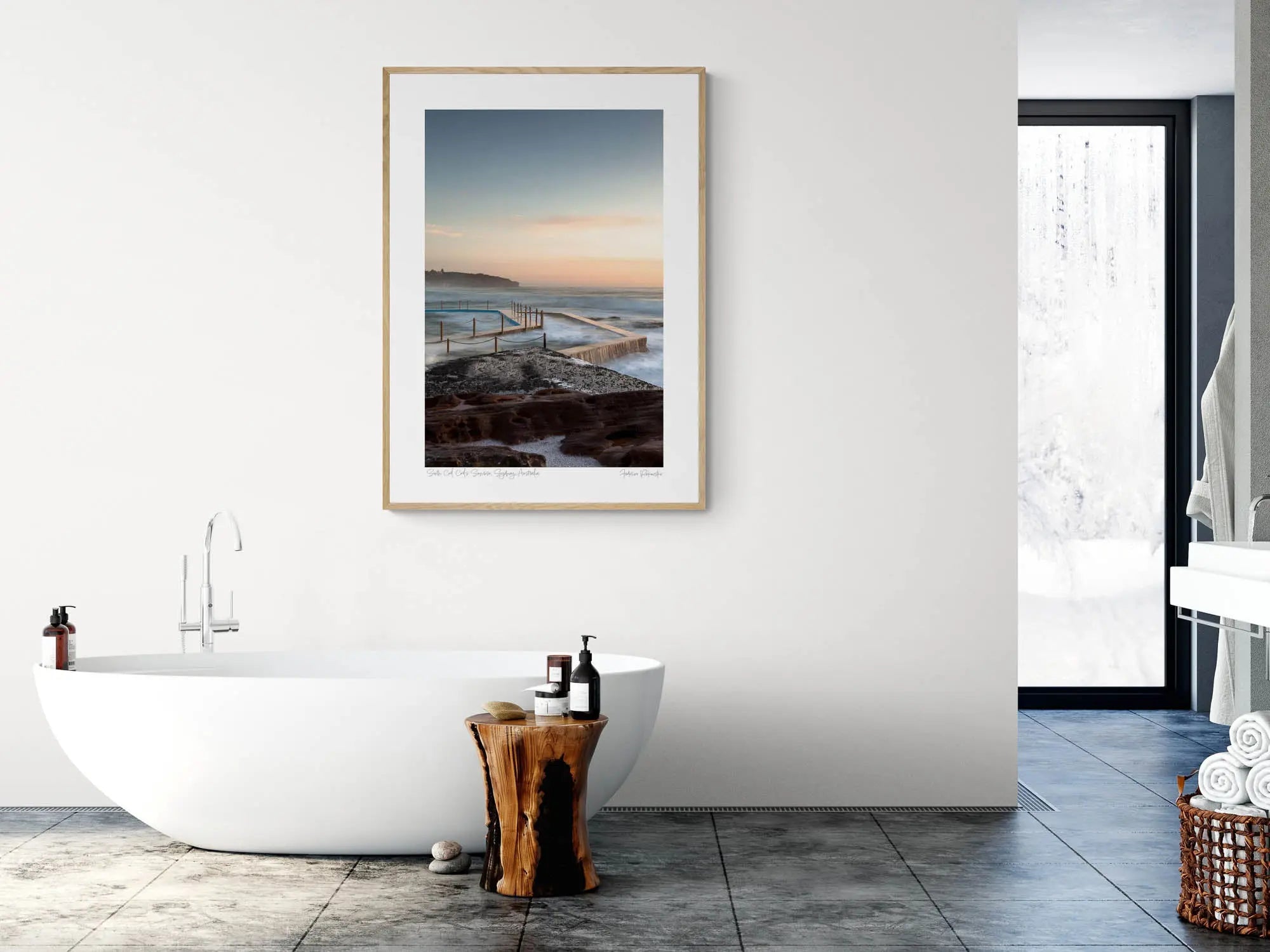 Twilight at South Curl Curl pool with smooth water flowing over its edges, bordered by textured rocks against a pastel sky.