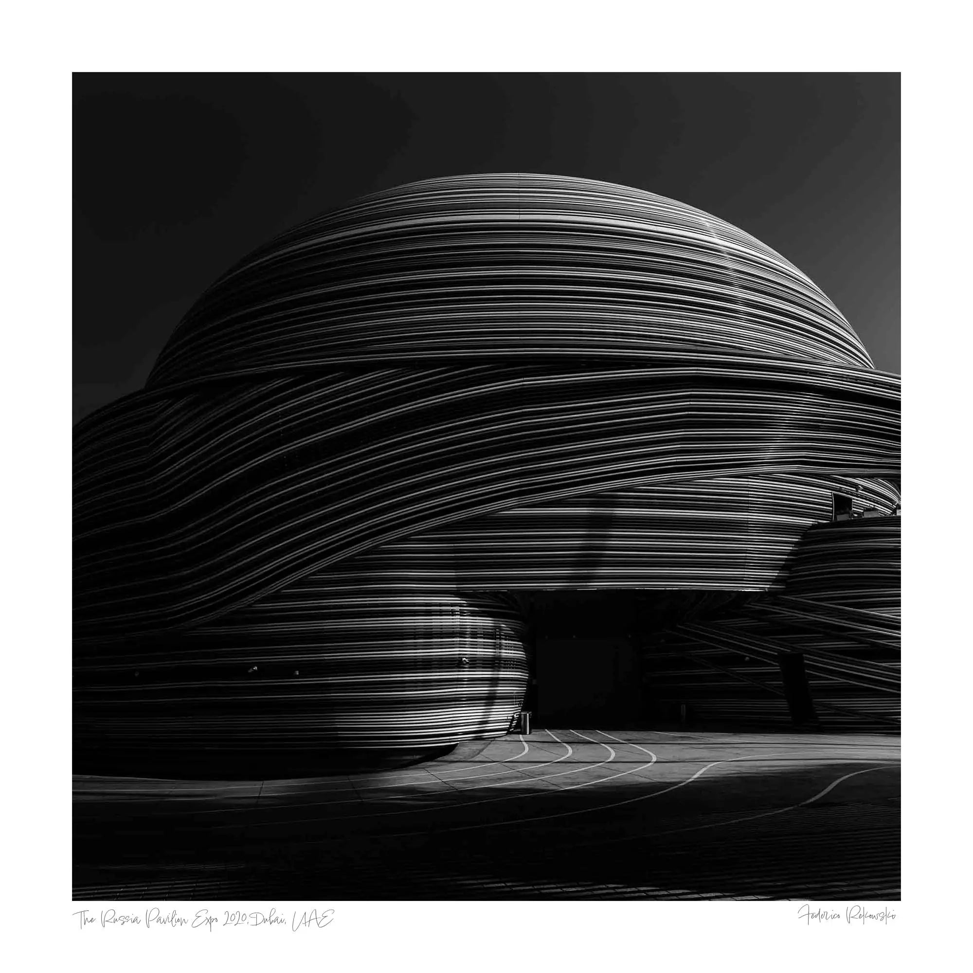 Black and white photo showcasing the striking, layered lines of the Russia Pavilion in Dubai.