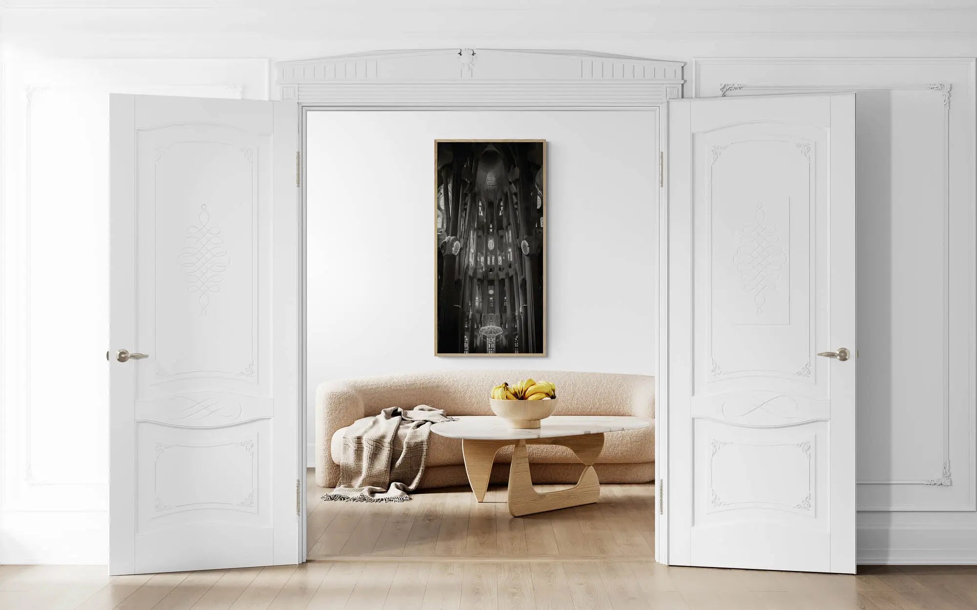 "Black and white interior view of La Sagrada Familia's columns and ceiling details, capturing the play of light and shadow."