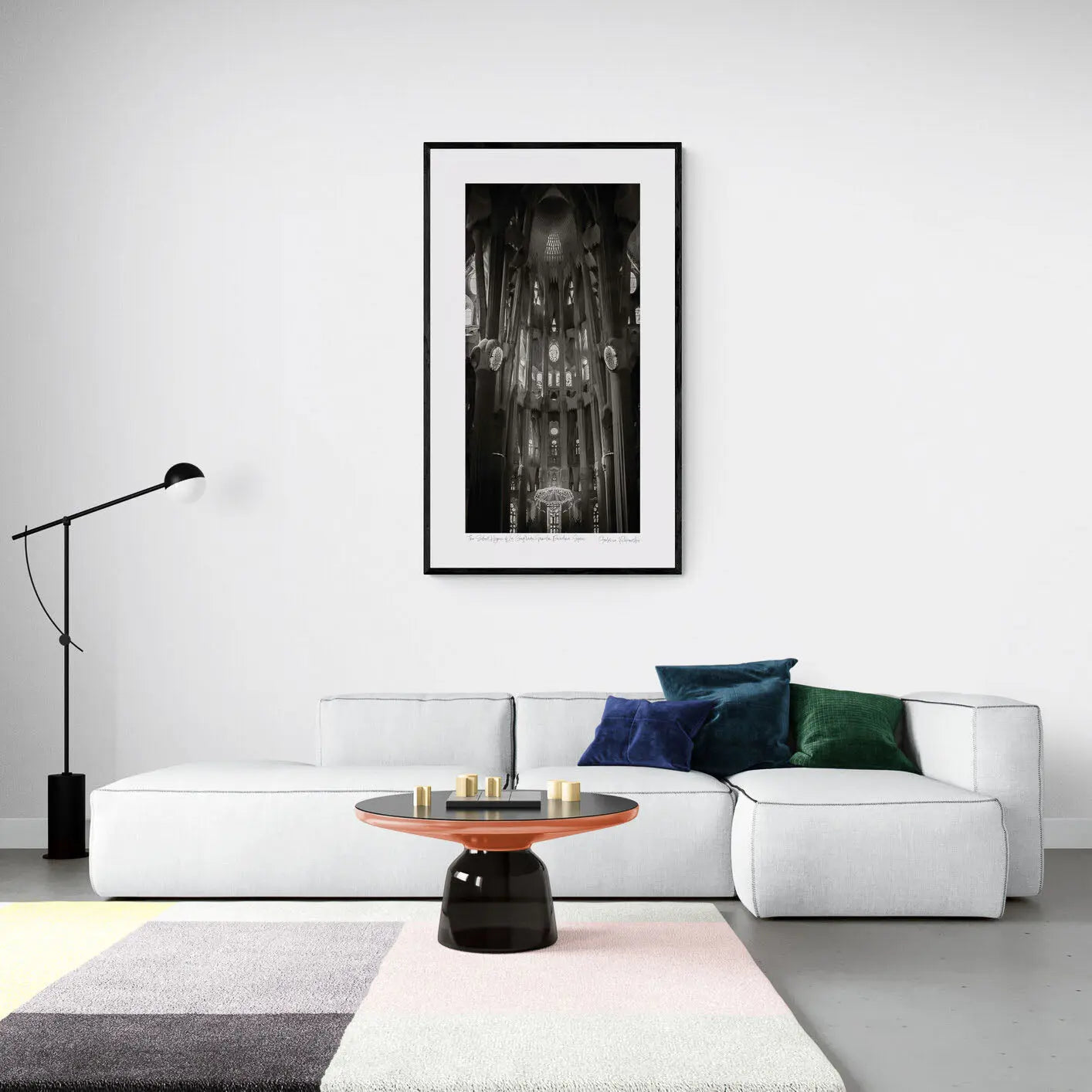"Black and white interior view of La Sagrada Familia's columns and ceiling details, capturing the play of light and shadow."