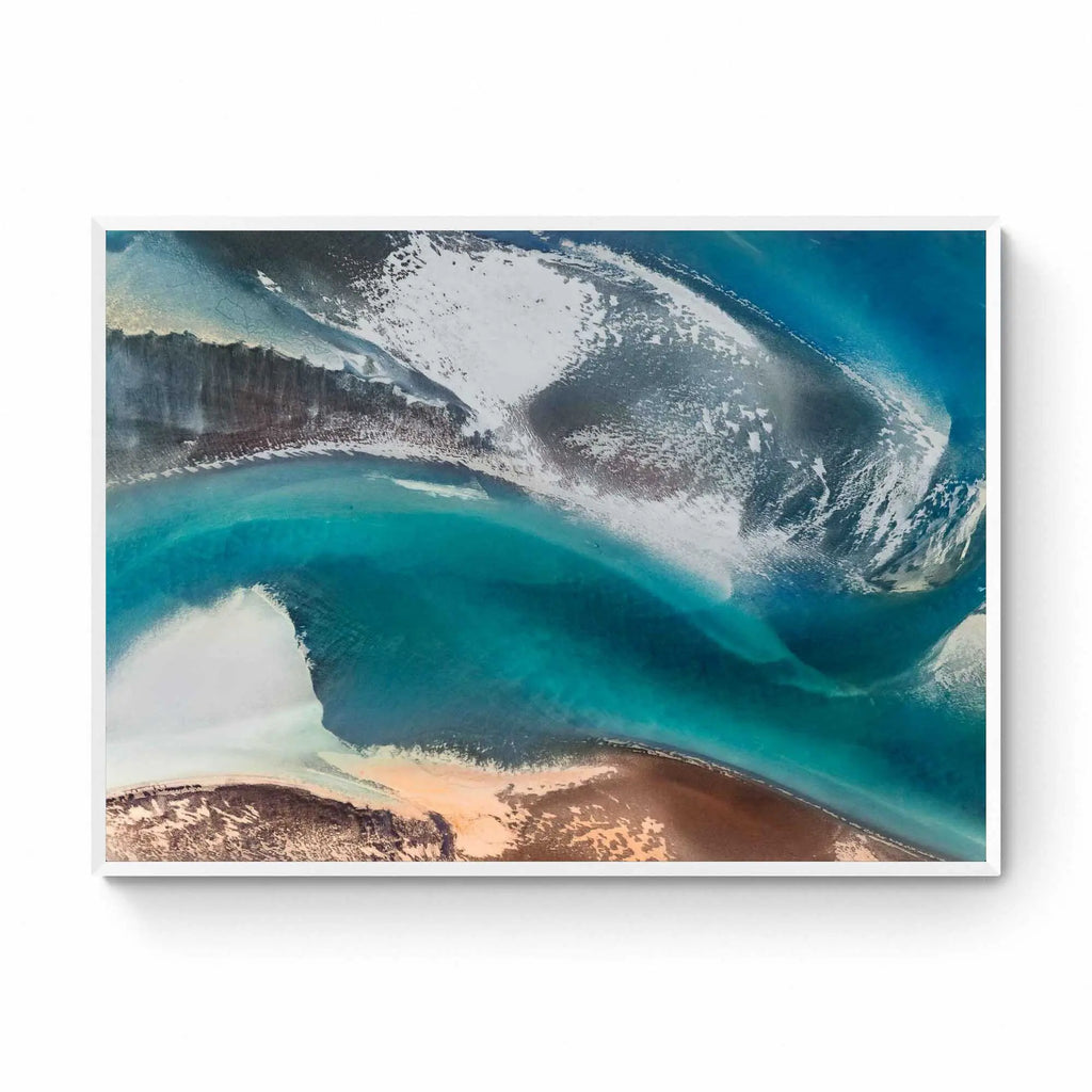 Aerial view of a stunning natural color palette in Iceland with shades of blue, white, and brown in an abstract composition.