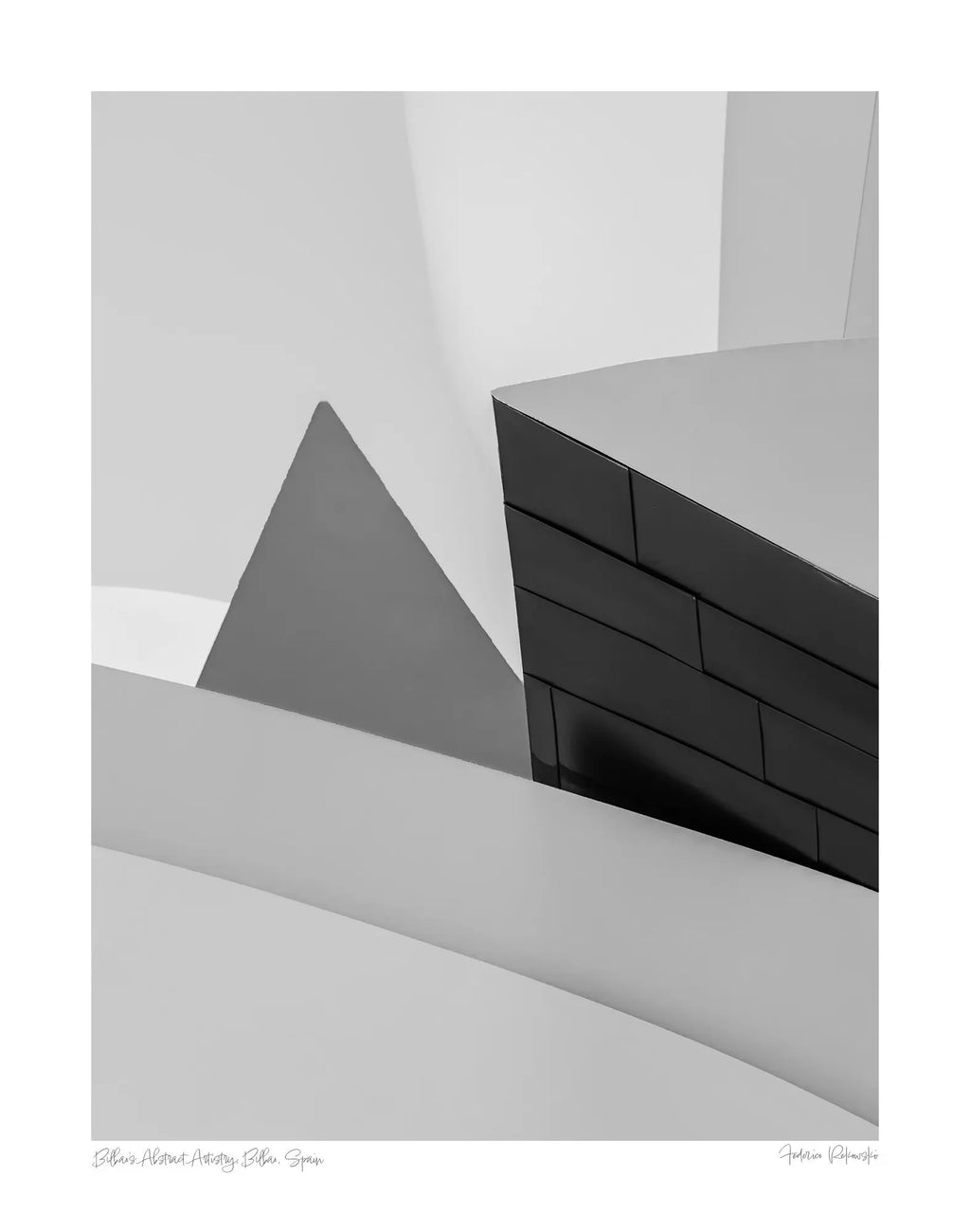 Abstract geometric shapes in a monochrome palette at the Guggenheim Museum Bilbao, showcasing contemporary architectural design.