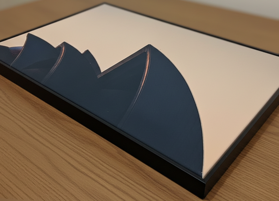 Framed canvas artwork with abstract design on a wooden surface