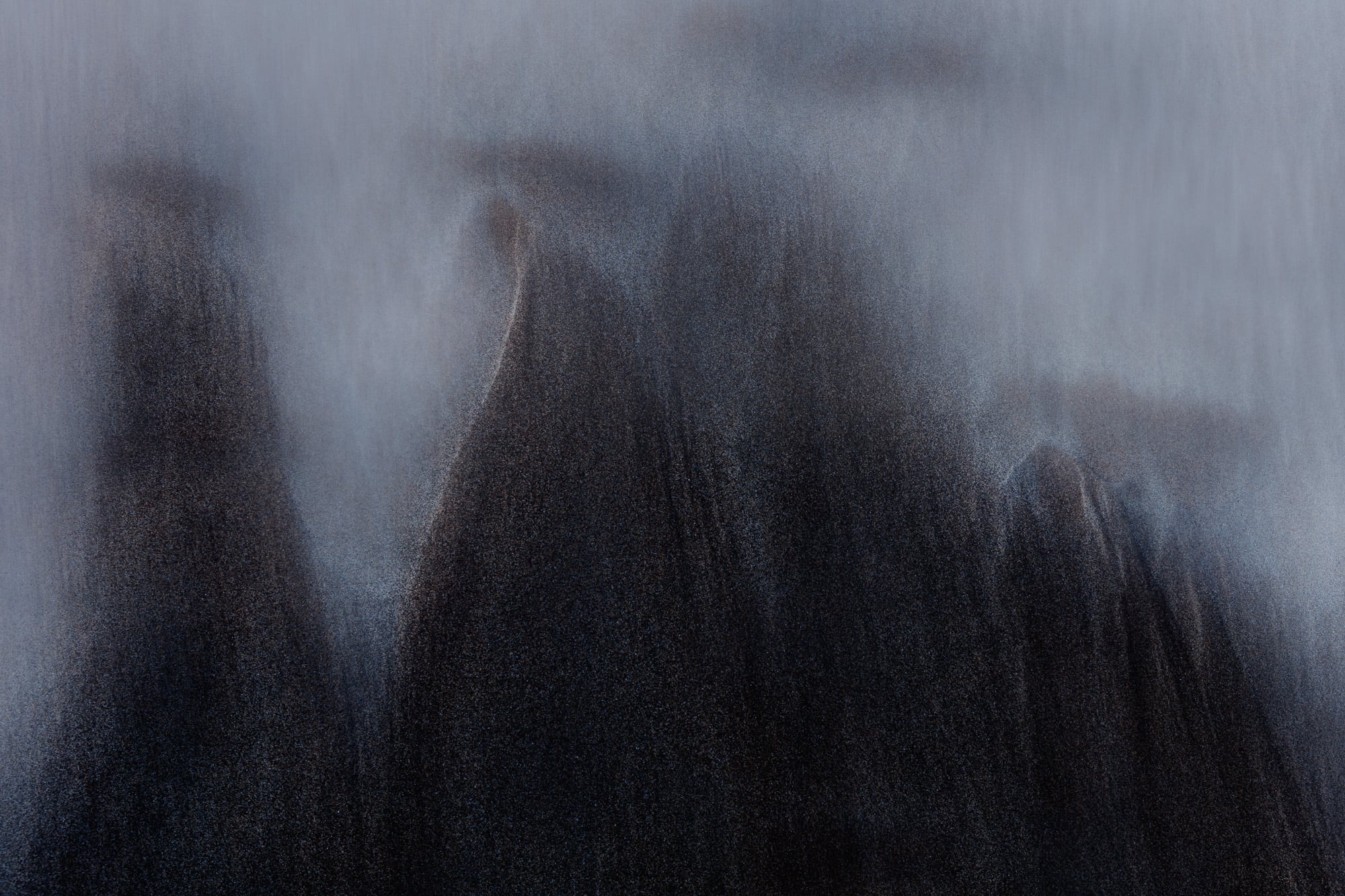 Abstract image of sand dunes in Ayries Inlet, Victoria, resembling mountain peaks in a mist-like effect.