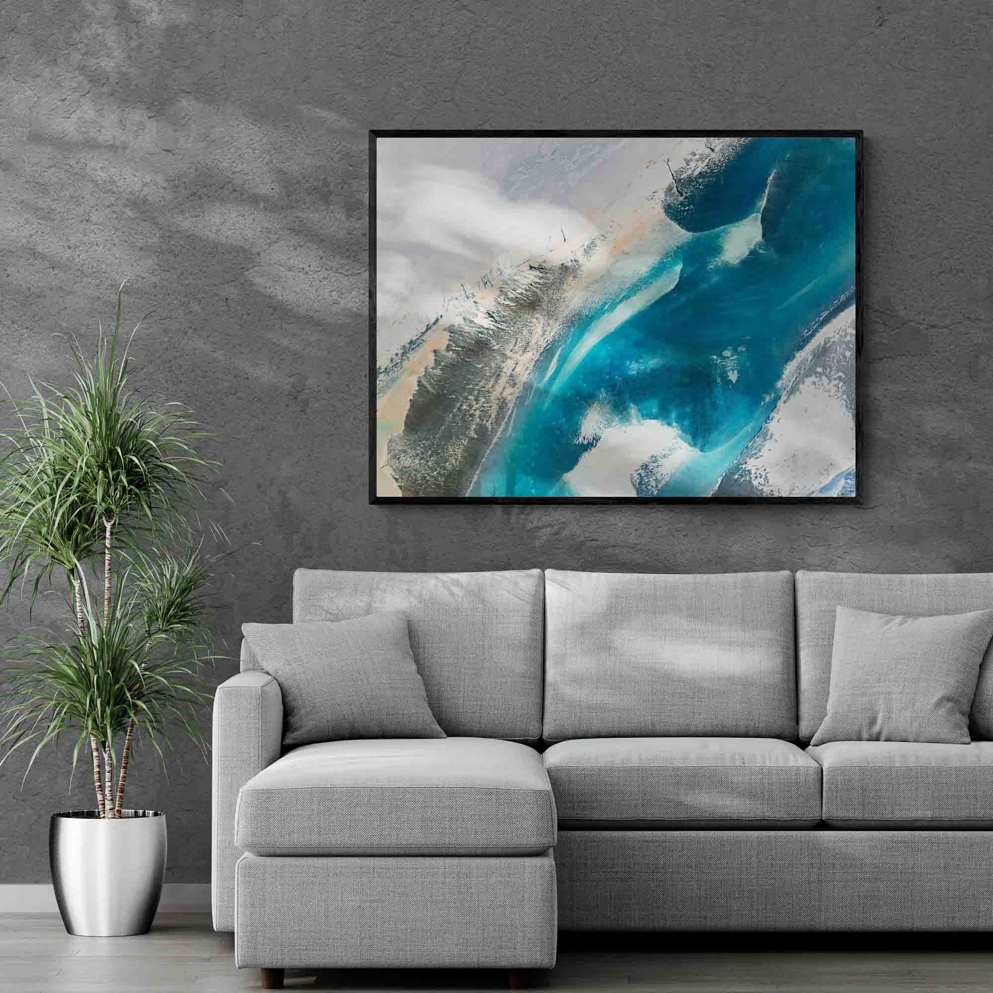 An aerial photograph of rivers in Iceland framed on canvas on a living room