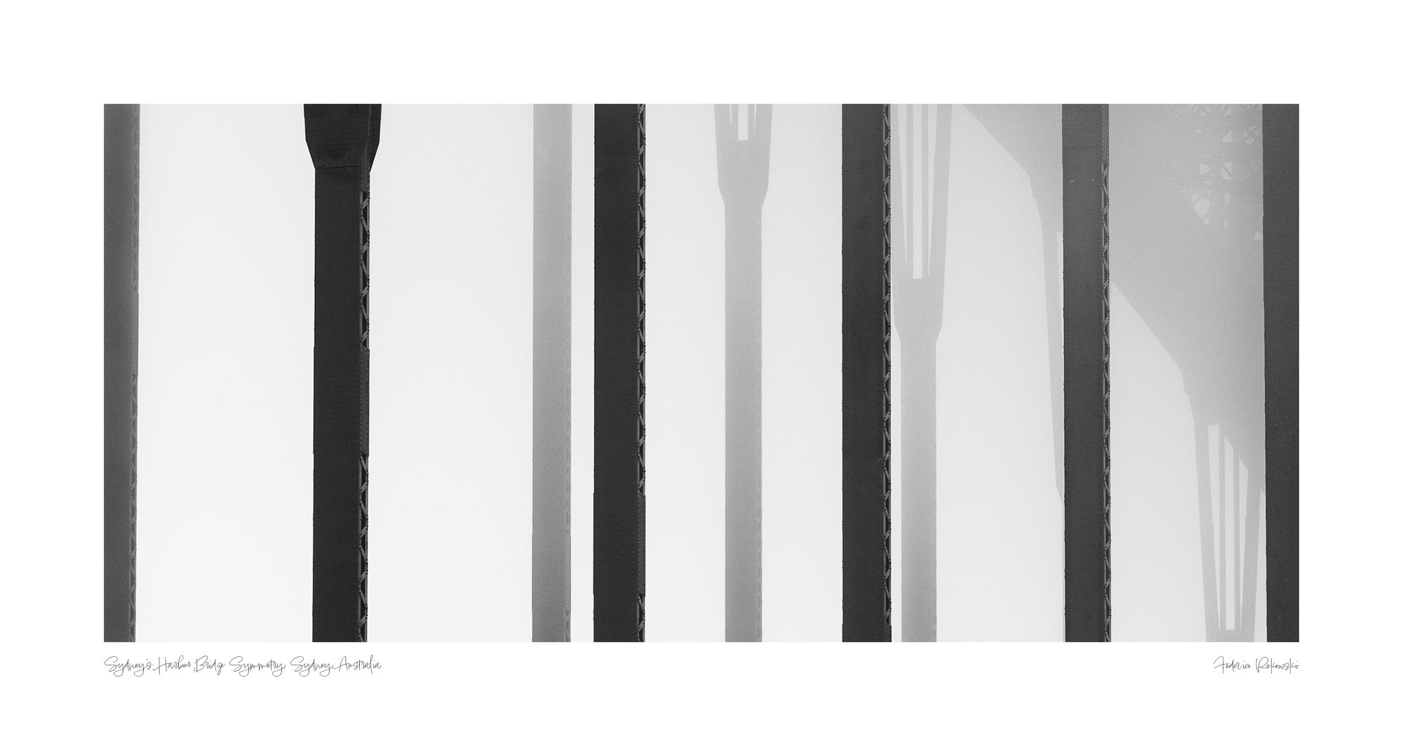 Black and white close-up of the vertical steel stanchions of Sydney Harbour Bridge, displaying a play of light and shadows.