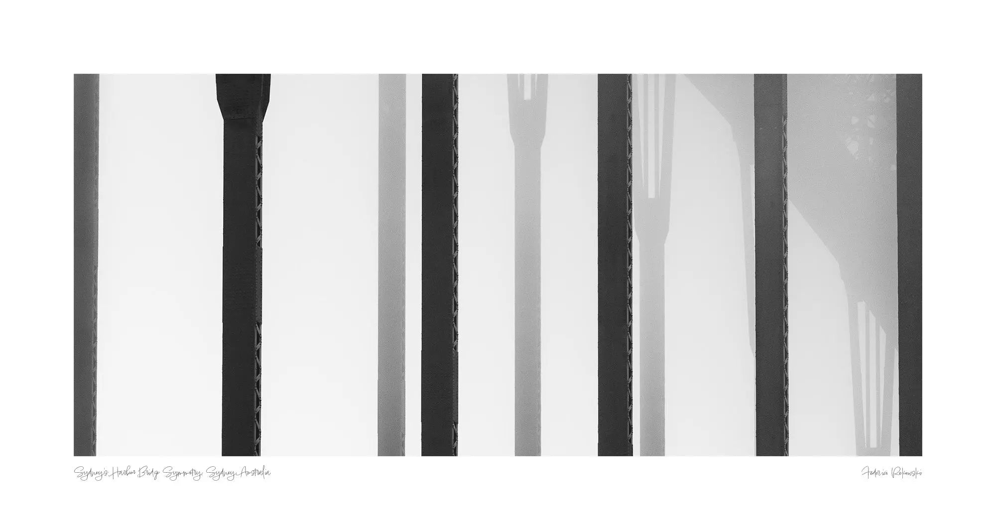 Black and white close-up of the vertical steel stanchions of Sydney Harbour Bridge, displaying a play of light and shadows.