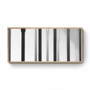 Black and white close-up of the vertical steel stanchions of Sydney Harbour Bridge, displaying a play of light and shadows.