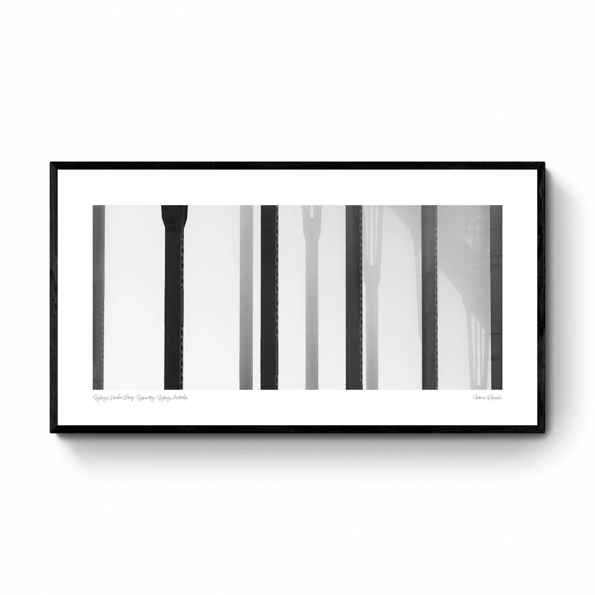 Black and white close-up of the vertical steel stanchions of Sydney Harbour Bridge, displaying a play of light and shadows.