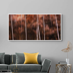 "ICM photography of trees in the Italian Dolomites, showcasing deep autumn colors in a blurred, artistic style."