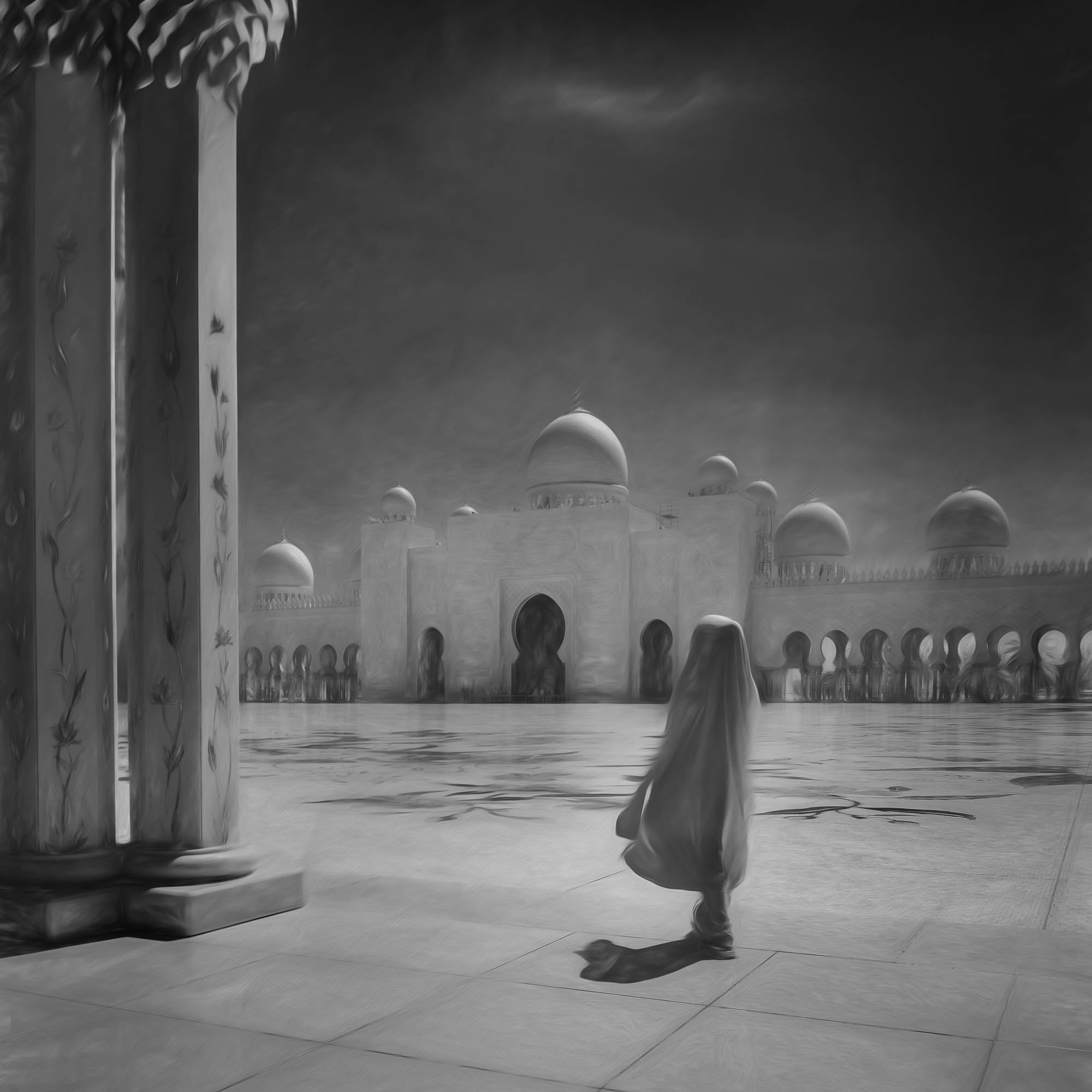 A woman in traditional attire stands alone amidst the grandeur of the Grand Mosque in Abu Dhabi, portrayed in black and white.