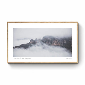 The Three Sisters rock formation in Sydney, Australia, is enshrouded in mist, as viewed from Sublime Point.