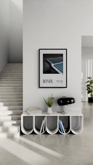Bondi Landmark Edition poster featuring Sydney’s Bondi Icebergs, open-edition photographic wall art by Federico Rekowski on a living room next to an staircase 
